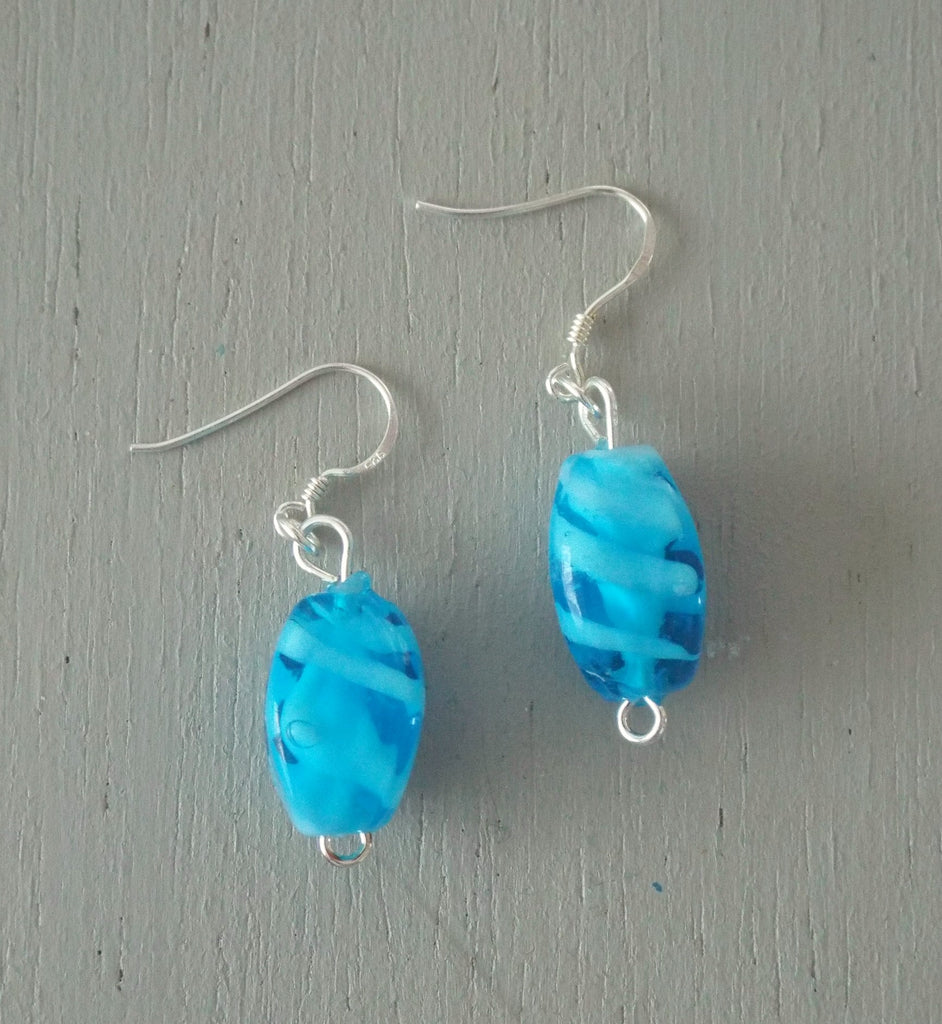 Earrings with blue & white swirl lozenges