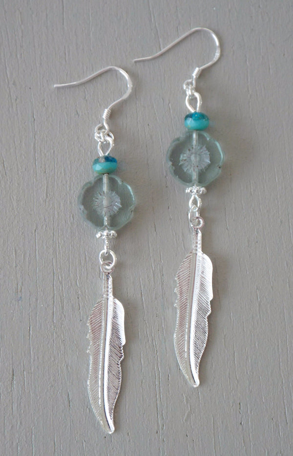Earrings with bright silver plated feather charms, aqua / seagreen beads