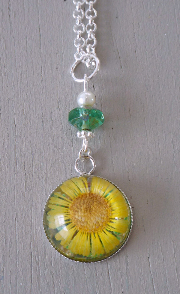 Pendant with 18mm yellow daisy focal, green accents