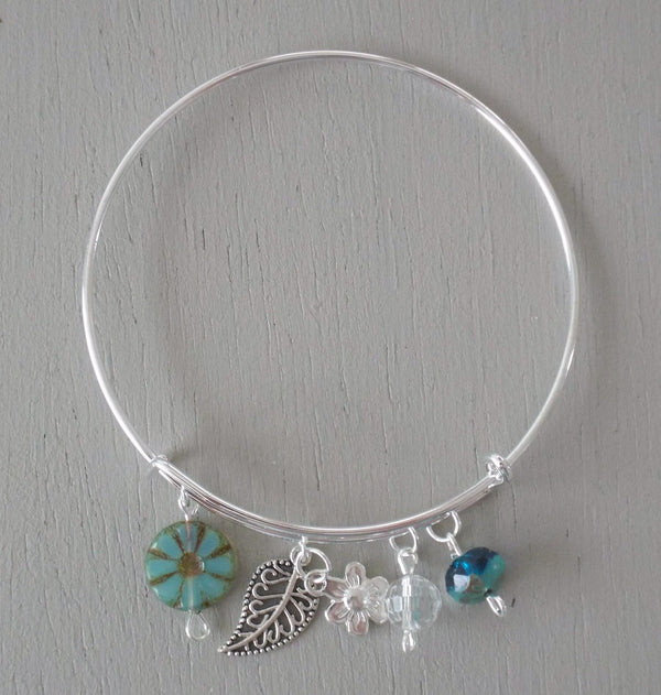Adjustable bangle, silver plated filigree leaf & flower charms, seagreen beads