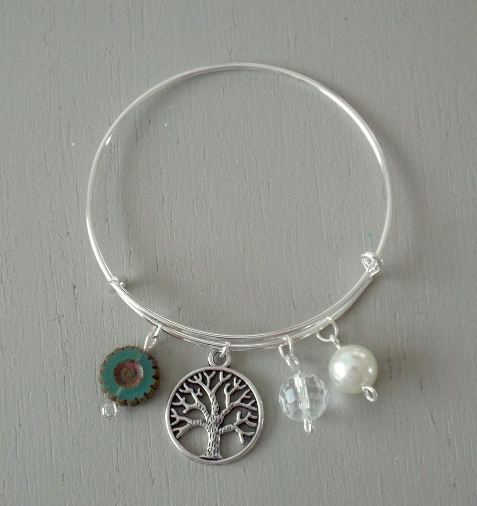 Adjustable silver plated bangle with tree of life charm with green and pearl beads