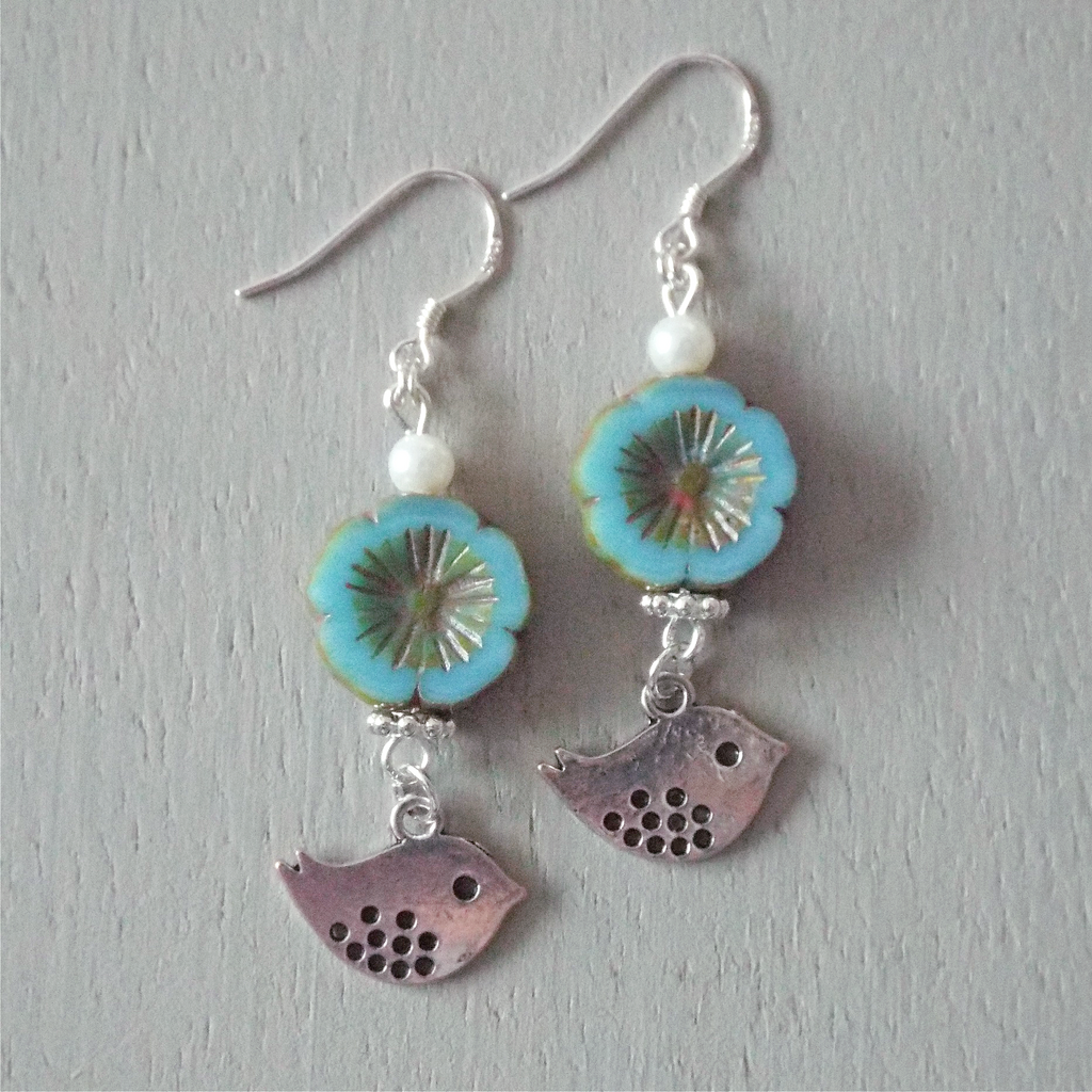Earrings – blue bronze-finish floral discs, spotted birdie charms