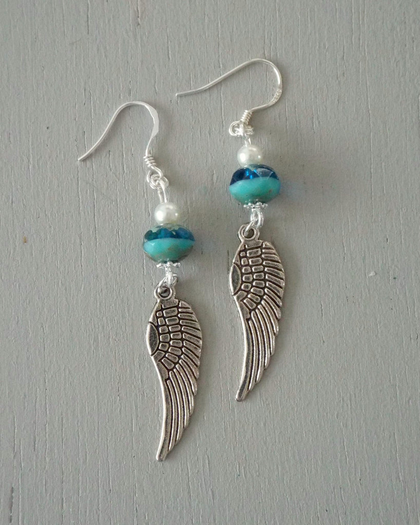 Earrings with silver angel wings with sea green & ivory beads