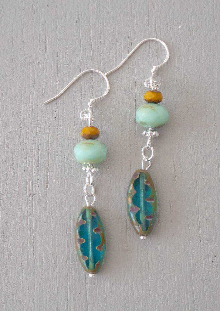 Earrings with teal carved ovals, mint rondelles & mustard minis