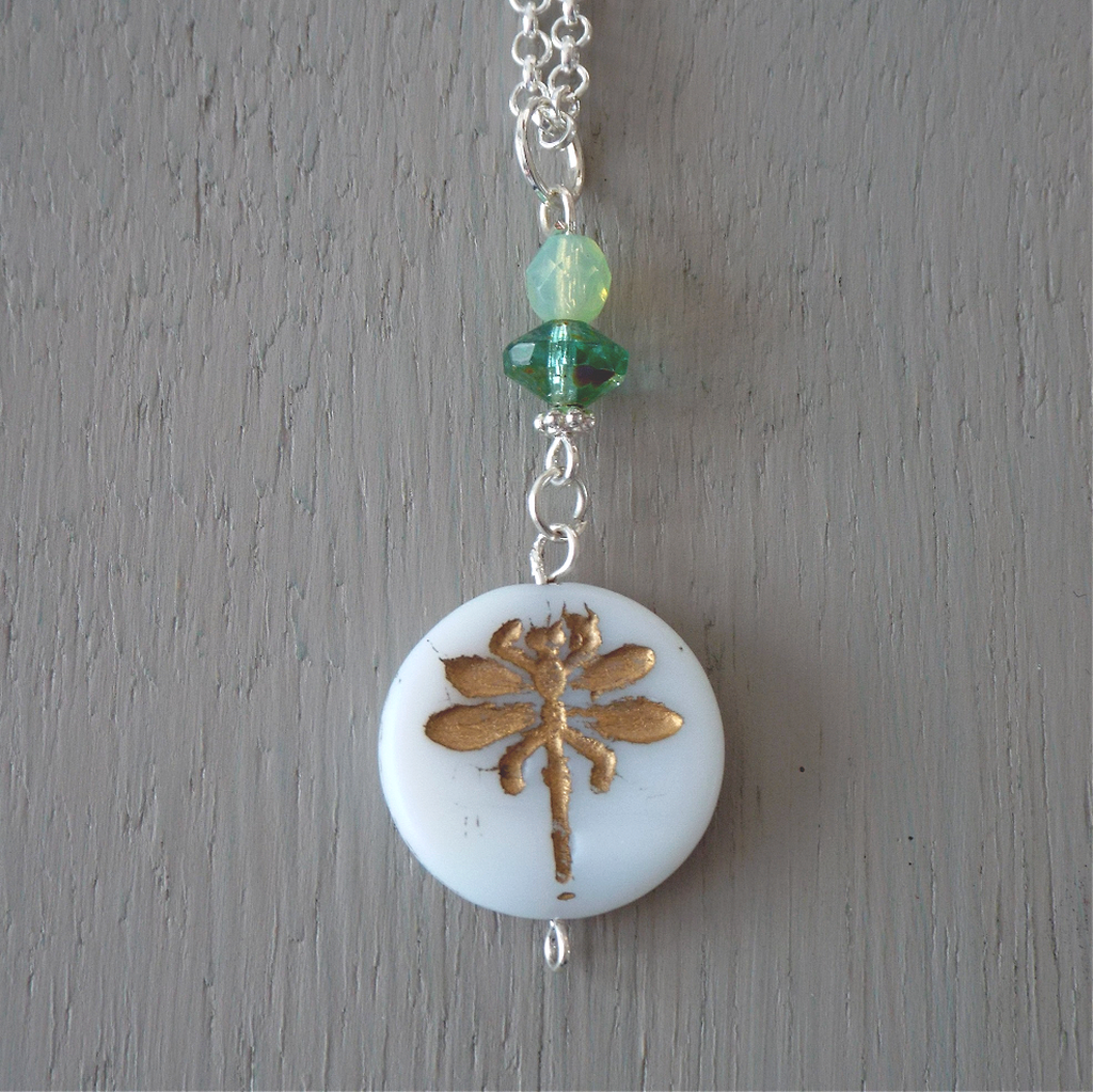 Pendant - 22mm white & gold-carved dragonfly disc, green bead accents