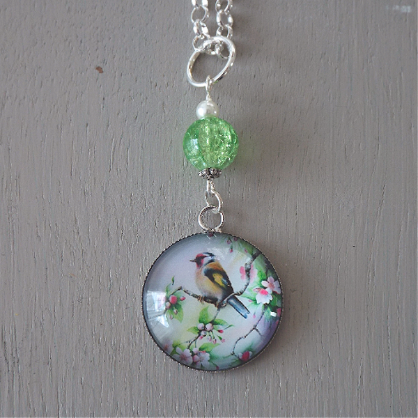 Pendant - 25mm white / green bird focal, green crackle glass, ivory pearl beads