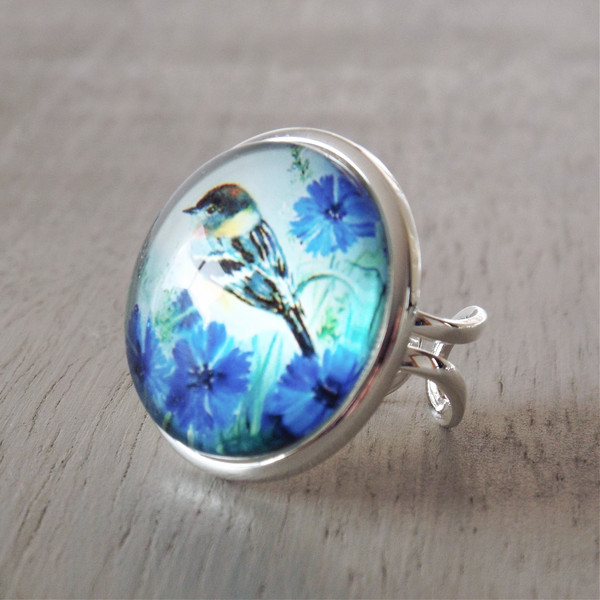 25mm adjustable ring with blue floral & bird themed cabochon